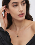 Load image into Gallery viewer, Monokeros Pendant in 10k Gold with Diamonds and Garnet
