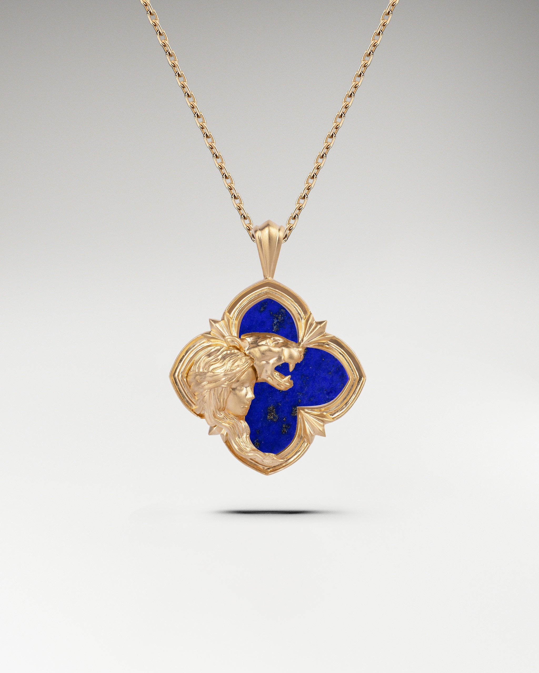 Gold pendant necklace featuring nacre in a wild encounter design.