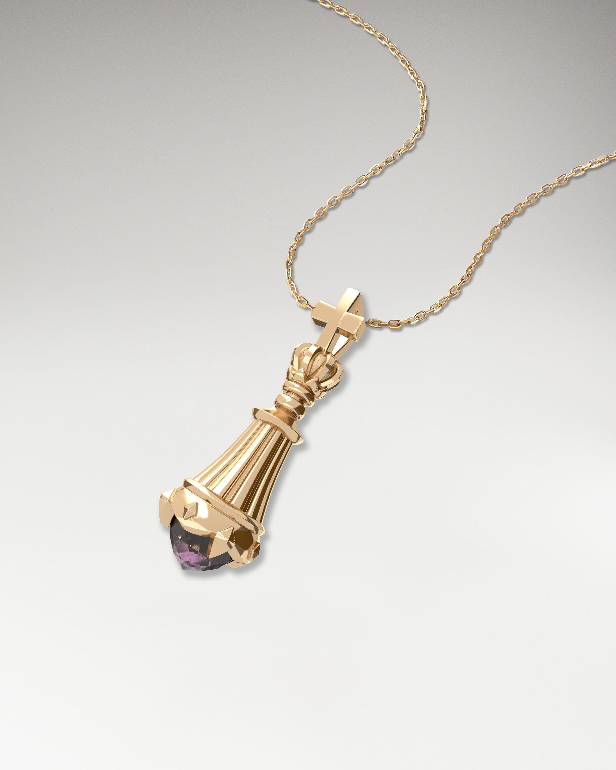 Gold king chess necklace with spinel gemstone.