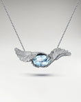 Load image into Gallery viewer, Feather Embrace Pendant Necklace In Sterling Silver With Topaz
