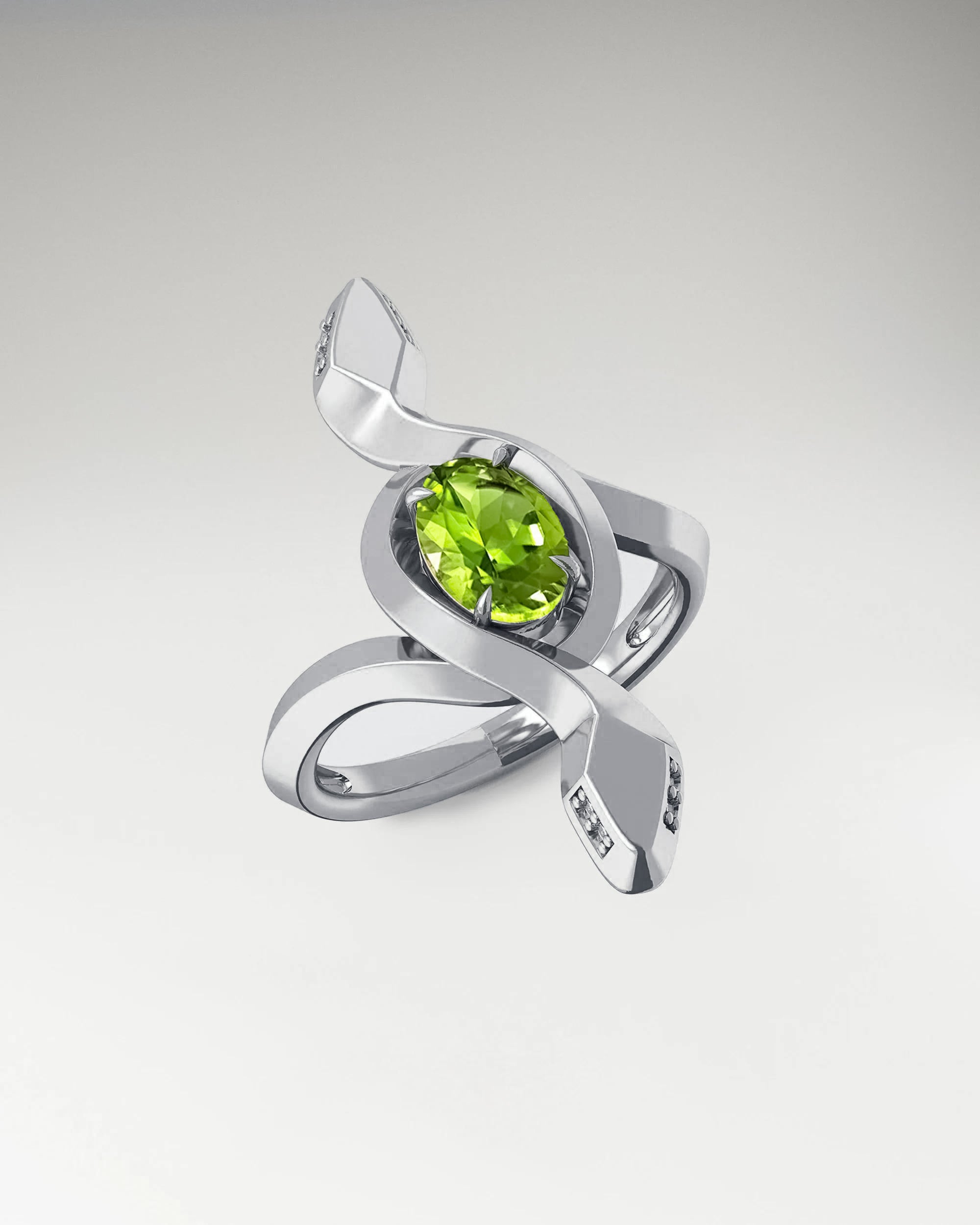 viper ring in gold with peridot and diamond gemstone